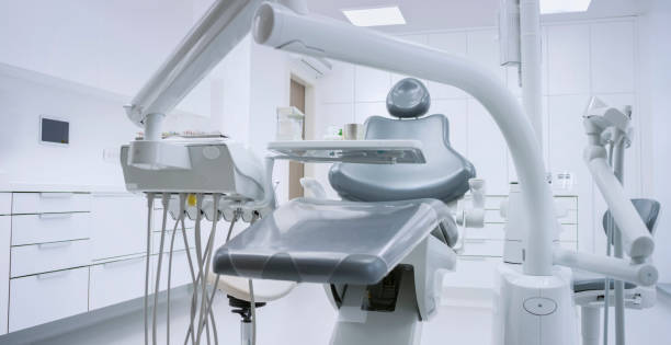 Dental Office Cleaning specialist disinfecting high-touch surfaces in a Marlboro, NJ treatment room before the morning schedule
